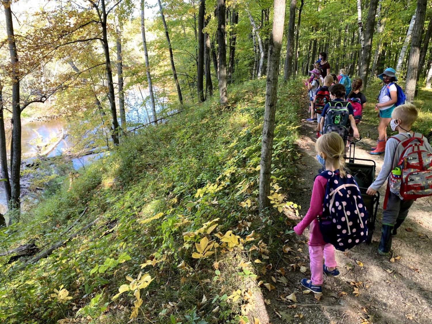 school group hike along the river