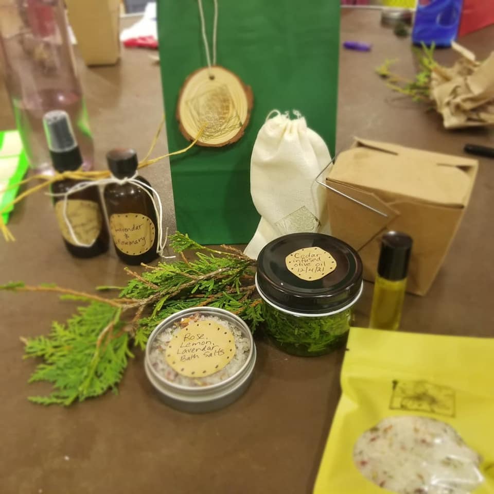 table with a collection of handmade herbal gifts from Moonwise Herbs